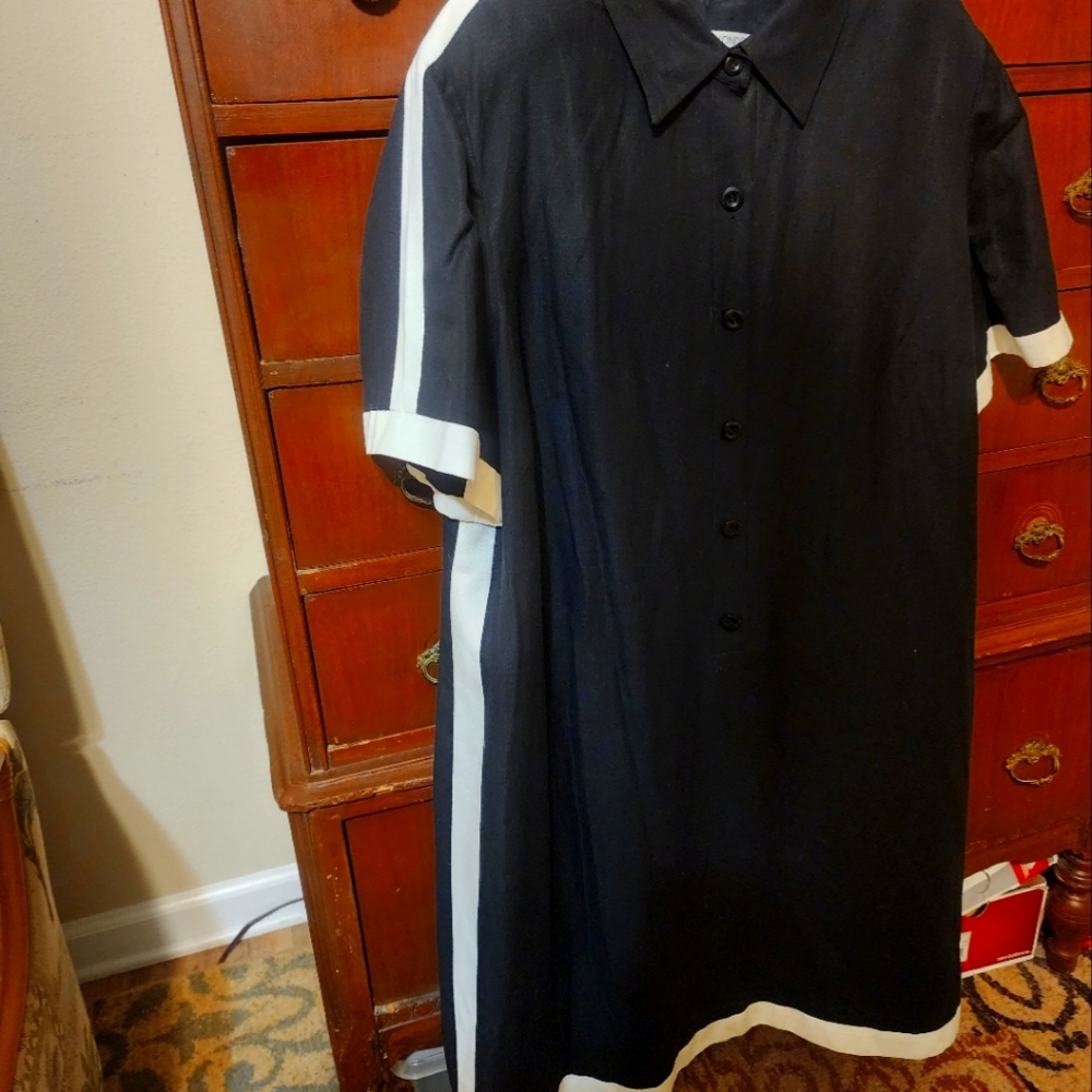 Linen/Rayon black dress with white trim. Perfect with tights or boots.